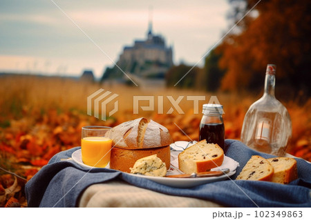 French picnic in autumn with mont saint-michel on background. Generative AI 102349863