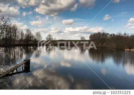 Sunny day with clouds above lake, Czech Republic Sunny day with clouds above lake, Czech Republic 102351325