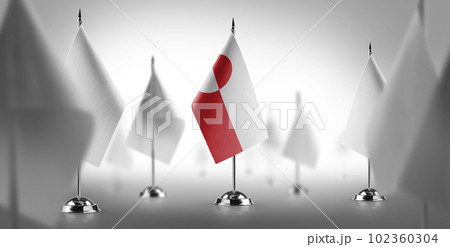 The national flag of the Greenland surrounded by white flags 102360304