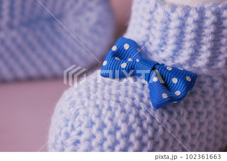 blue color Knitted shoes for an infant. blue color Knitted shoes for an infant. 102361663