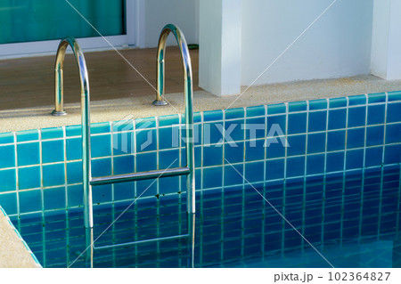 blue swimming pool at hotel with stair 102364827