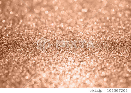 Abstract blur rose gold glitter sparkle defocused bokeh light background Abstract blur rose gold glitter sparkle defocused bokeh light background 102367202