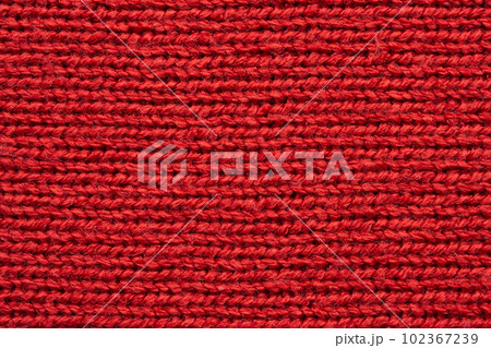 Red knitted cloth wool texture surface background Red knitted cloth wool texture surface background 102367239