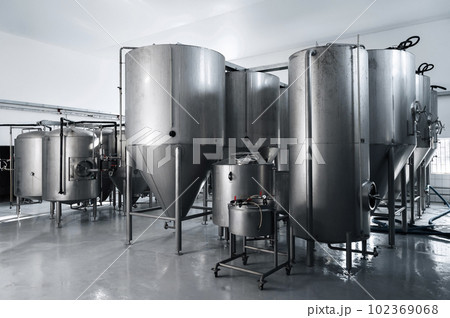 interior of modern brewery with beer fermentation tanks interior of modern brewery with beer fermentation tanks 102369068