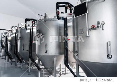 interior of modern brewery with beer fermentation tanks interior of modern brewery with beer fermentation tanks 102369071