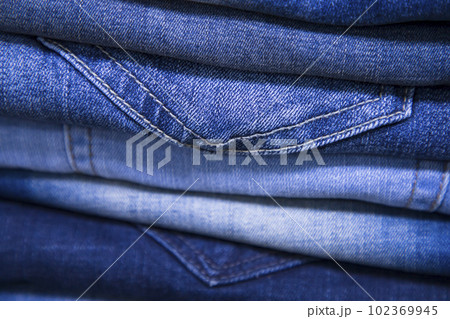folded blue jeans pant pattern texture can be used as a background wallpaper 102369945