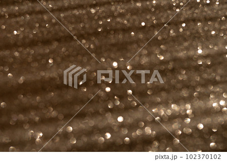 Blurred photo glitter texture on black background. Blurred photo glitter texture on black background. 102370102
