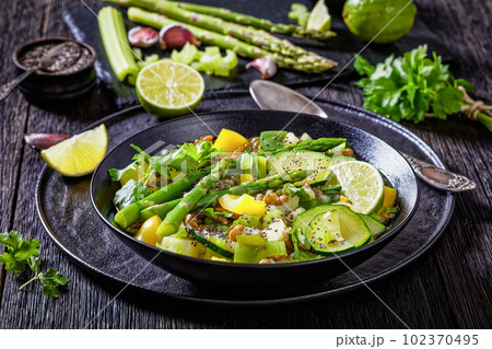 alkaline green soup in black bowl, top view 102370495