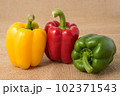 Ripe vibrant colorful peppers on sackcloth Ripe vibrant colorful peppers on sackcloth 102371543