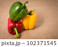 Ripe vibrant colorful peppers on sackcloth Ripe vibrant colorful peppers on sackcloth 102371545