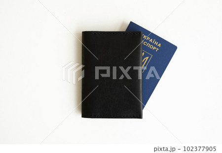 Ukrainian biometric passport id with a genuine leather cover on a white background. 102377905