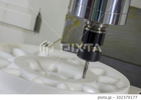 The CNC milling machine cutting the nylon 6 material part with ball end mill tool. The CNC milling machine cutting the nylon 6 material part with ball end mill tool. 102378177