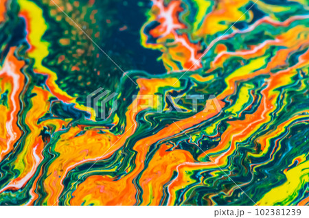 abstract background of the oil paint on a water surface in rainbow colors 102381239