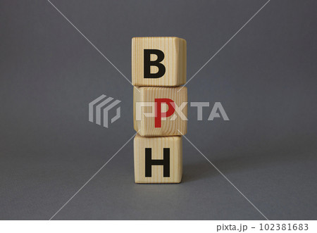 BPH - Benign Prostatic Hyperplasia symbol. Wooden cubes with word BPH. Beautiful grey background. Medical and BPH concept. Copy space. 102381683