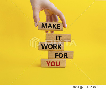 Make it work for you symbol. Business Concept words Make it work for you on wooden blocks. Beautiful yellow background. Businessman hand. Business concept. Businessman hand. Copy space Make it work for you symbol. Business Concept words Make it work for you on wooden blocks. Beautiful yellow background. Businessman hand. Business concept. Businessman hand. Copy space 102381808