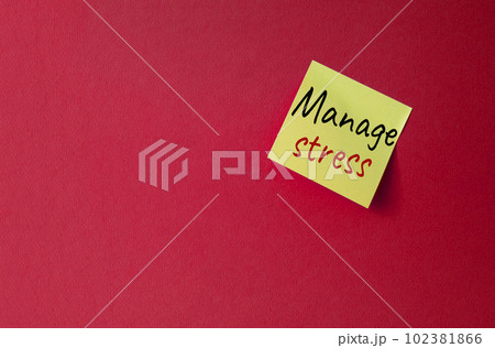 Manage stress symbol. Concept word Manage stress on orange steaky note. Beautiful red background. Business and Manage stress concept. Copy space 102381866