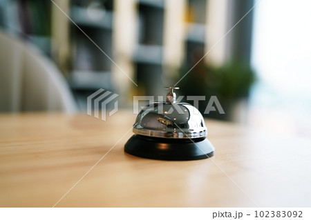 Hotel reception counter desk with service bell. front desk bell for call staff service. Hotel reception counter desk with service bell. front desk bell for call staff service. 102383092