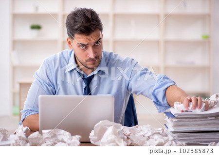 Young male employee in brainstorming concept Young male employee in brainstorming concept 102385873
