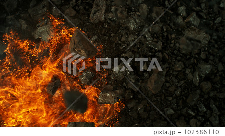 Burning coal with fire, top view shot. Burning coal with fire, top view shot. 102386110