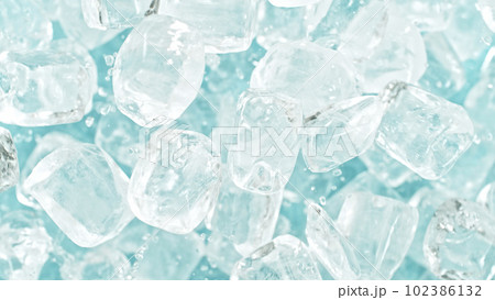 Freeze motion of flying ice cubes isolated on blue background. Freeze motion of flying ice cubes isolated on blue background. 102386132