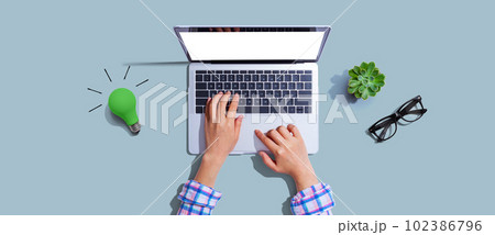 Green light bulb with a laptop computer Green light bulb with a laptop computer 102386796