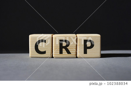 CRP - C-Reactive Protein Test symbol. Wooden cubes with word CRP. Beautiful grey background. Medical and C-Reactive Protein Test concept. Copy space. 102388034