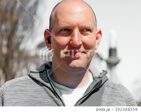 Portrait of a handsome hipster man. A man in a big city on the street, a life style concept Portrait of a handsome hipster man. A man in a big city on the street, a life style concept 102388359
