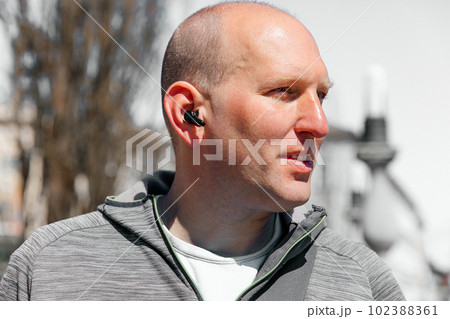 Portrait of a handsome hipster man. A man in a big city on the street, a life style concept 102388361