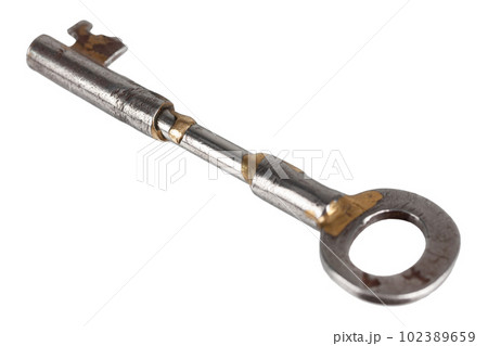 Old rusty key on a white background. 102389659