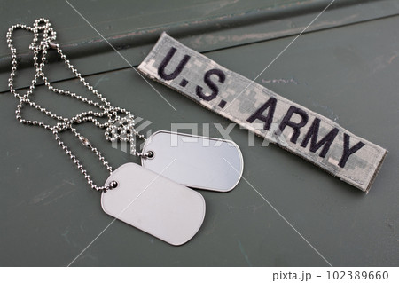 US ARMY branch tape and dog tag on green ammo can 102389660