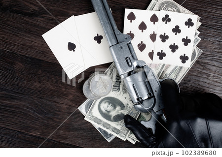 Dead man's hand. Two-pair poker hand consisting of the black aces and black eights and player hand with revolver gun. 102389680