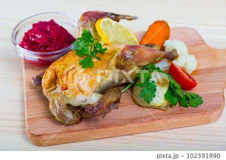 Roasted partridge with cranberry sauce 102391990