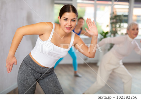 Young woman doing fitness in fitness studio Young woman doing fitness in fitness studio 102392256