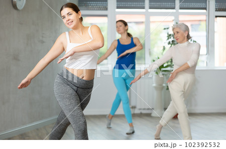 Young woman is dancing in fitness studio 102392532