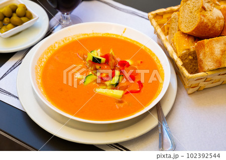 Spanish cold soup gazpacho in bowl with tomatoes and cucumber 102392544