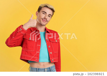 Happy gay man gesturing agreement raising a thumb up Happy gay man gesturing agreement raising a thumb up 102396921