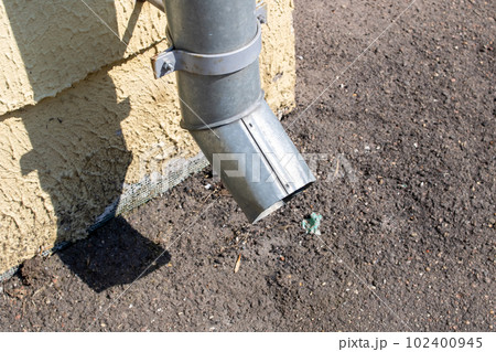 Downspout on the wall of the house 102400945
