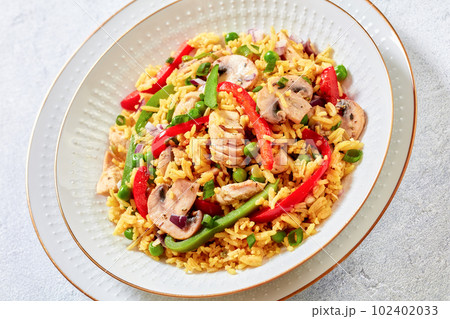 chicken mushroom paella with pepper, green peas chicken mushroom paella with pepper, green peas 102402033
