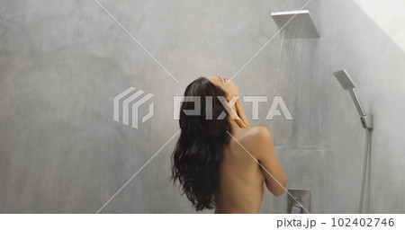 Back View of Young Adult Brunette Woman in Shower 102402746