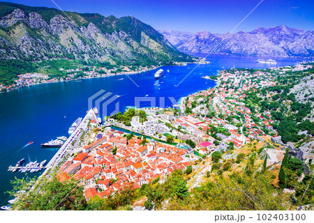 Kotor, Montenegro. Scenit sparkling Bay of Kotor, medieval walled city. 102403100