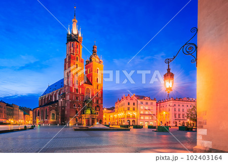 Krakow, Poland - Gothic beauty and historic charm shine at Cracovia's night scene. Krakow, Poland - Gothic beauty and historic charm shine at Cracovia's night scene. 102403164