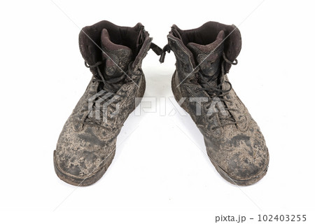 Black shoes, covered in mud 102403255