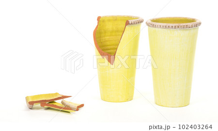 Broken and intact green vase, isolated on white Broken and intact green vase, isolated on white 102403264