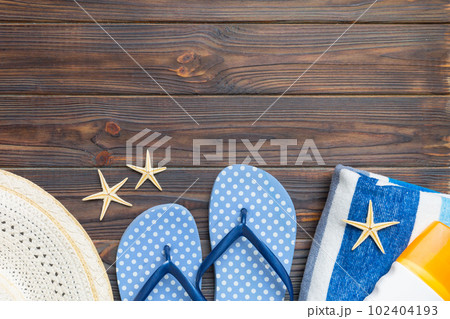 Summer vacation concept flat lay. straw hat beach accessories and towel top view. Space for text. travel concept Summer vacation concept flat lay. straw hat beach accessories and towel top view. Space for text. travel concept 102404193