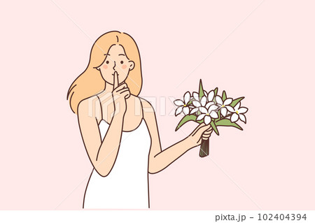 Woman with bouquet of flowers makes shh gesture with finger to lips, wanting to surprise loved one 102404394