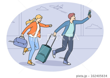 Worried tourists run for flight in airport Worried tourists run for flight in airport 102405634