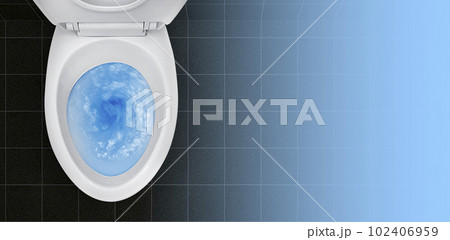 Top view of toilet bowl, blue detergent flushing in it 102406959