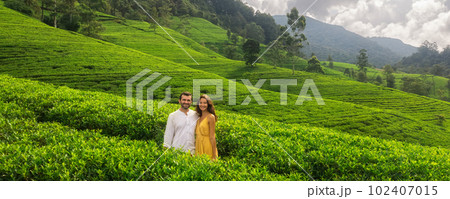 Aerial Drone View of Couple of Travelers on Green Tea Plantations Aerial Drone View of Couple of Travelers on Green Tea Plantations 102407015