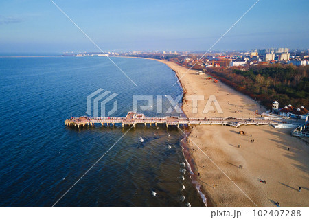 Baltic sea shore with view of Gdansk city, aerial view 102407288