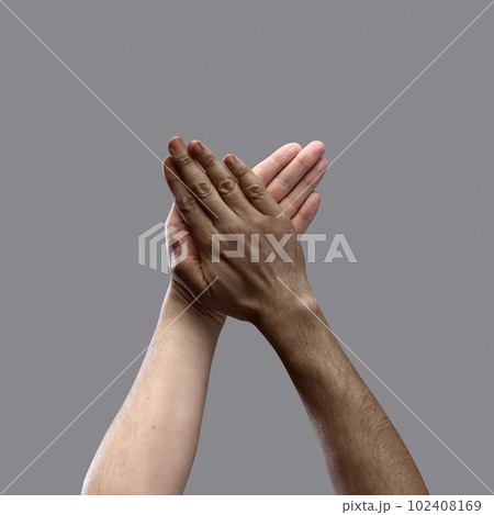 International unity. Human hands of diverse people of different race and skin color over grey background. Equality, support, acceptance 102408169